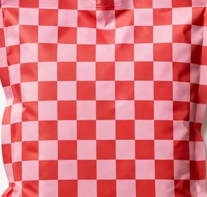 Close-up of the Checkerboard Club print, a pink and red checkerboard pattern
